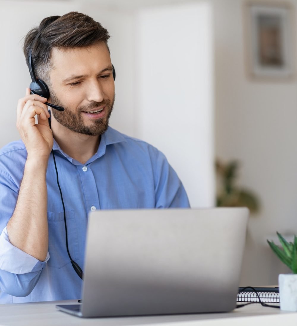 hotline-operator-portrait-of-call-center-employee-wearing-headset-at-workplace-in-office.jpg