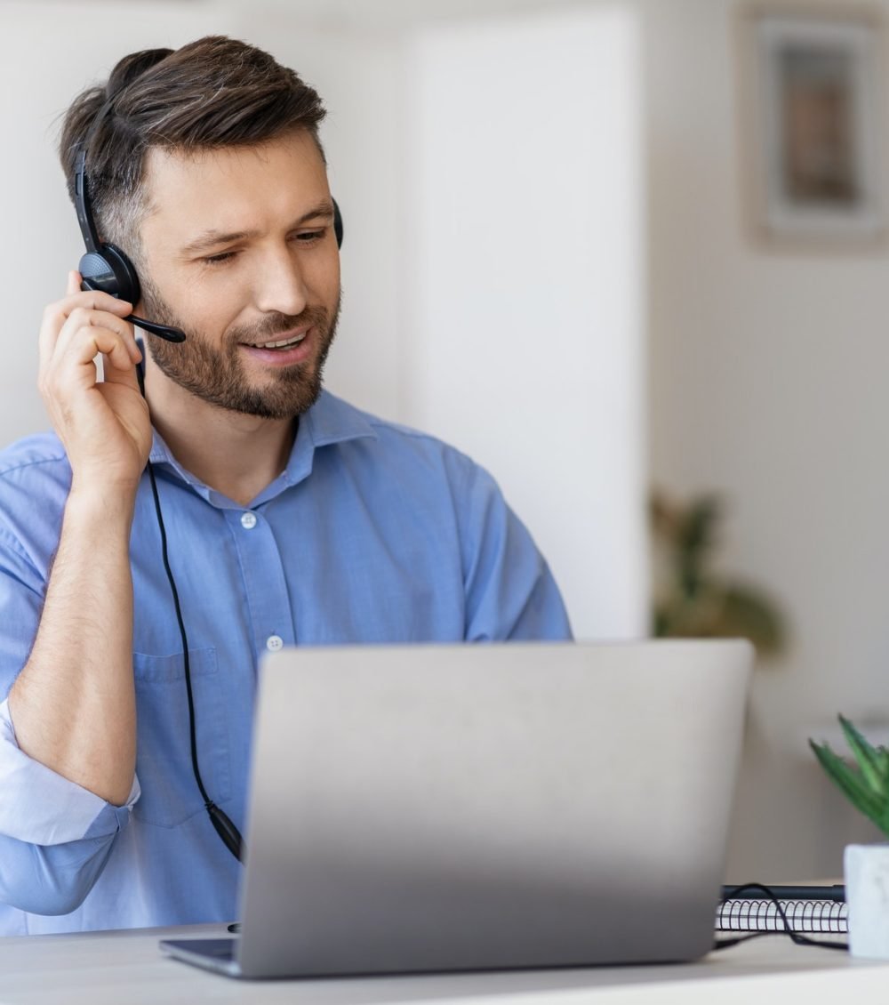 hotline-operator-portrait-of-call-center-employee-wearing-headset-at-workplace-in-office.jpg